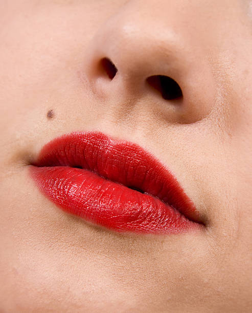 istock Female lips close up. Red color 489039345