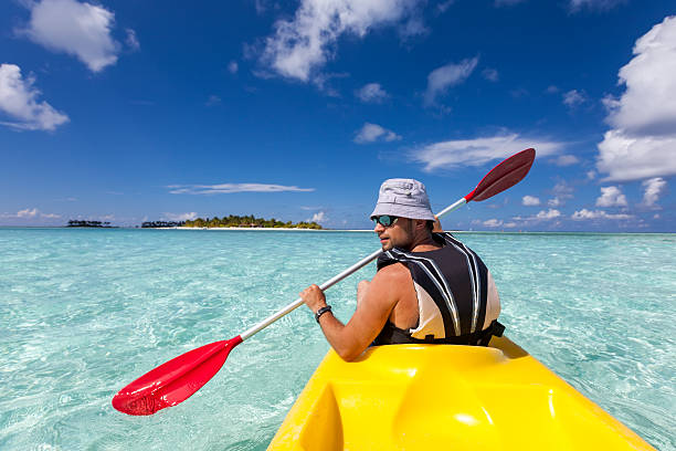 istock Young caucasian man kayaking in sea at Maldives 489039376
