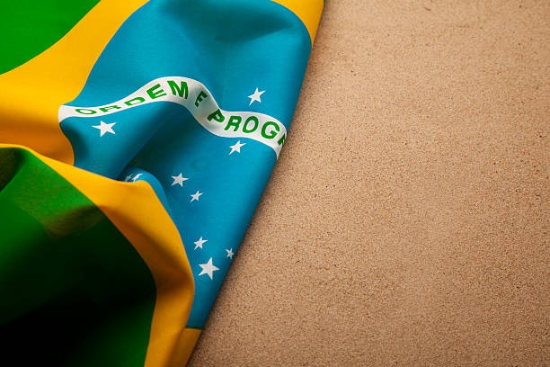 istock Brazilian flag on sand 489039593