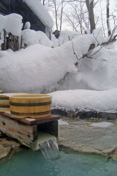 istock Japanese hot spring Open air bathtub in winter 489040806