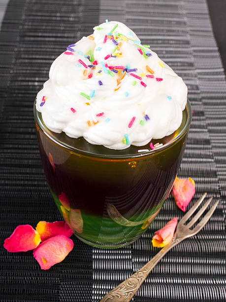 istock Colorful jelly with whipped cream and candy topping 489040932