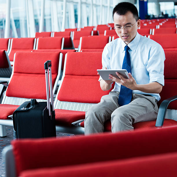 istock businessman at departure lounge 489042894