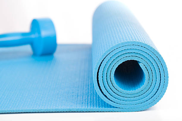 istock Yoga Mat and dumbbell on white background 489044016