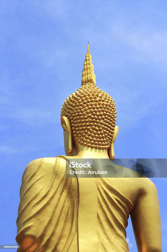 back  of  big  golden buddha statue back  of  big  golden buddha statue in thai temple Ancient Stock Photo