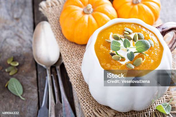 Pumpkin Soup With Cream Herbs And Seeds Stock Photo - Download Image Now - 2015, Appetizer, Autumn