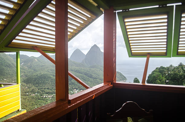 the pitons of soufriere st lucia greets viewers who open their window with a majestic imposing view.