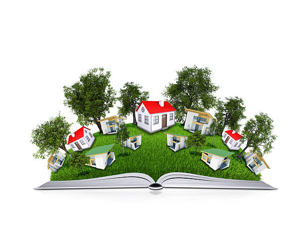 istock Trees and houses on the open book 489046631