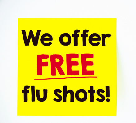 Free flu shots advertisement on sticky note