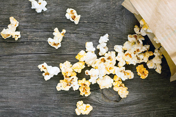 istock Salty popcorn on a dark gray wooden background 489077918