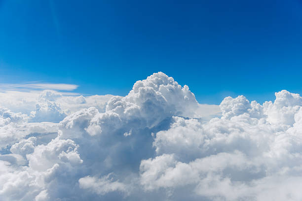 above the clouds puffy clouds and blue sky from above the clouds. cumulonimbus photos stock pictures, royalty-free photos & images