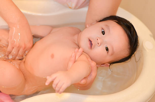 istock Five months asian baby taking a bath 489081683