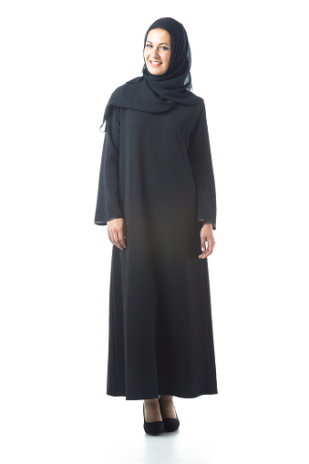 studio shot of young woman wearing traditional arabic clothing