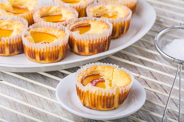 istock Cheesecake mini with peaches on a white plates 489084002