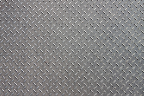 A diagonal pattern on gray metal