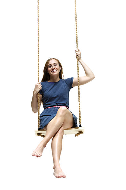 istock Smiling woman swinging 489086045