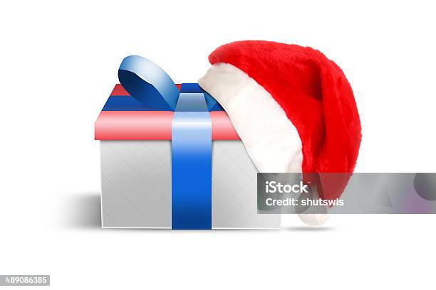 Santa Hat And Gift Stock Photo - Download Image Now - Cap - Hat, Celebration, Christmas