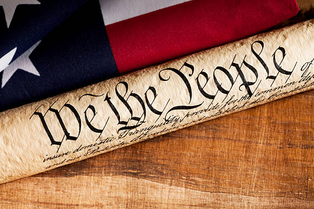 istock U.S. Constitution and American Flag 489086613