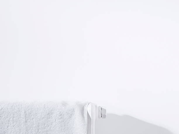 istock Towel on radiator and white wall 489087161