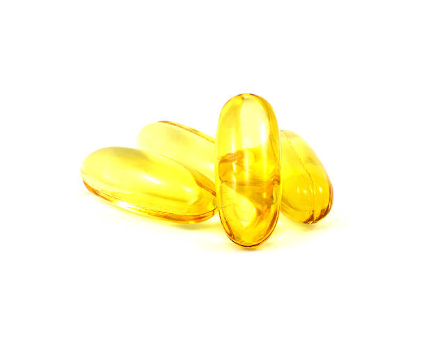 istock Cod liver oil omega 3 gel capsules isolated on white 489087633
