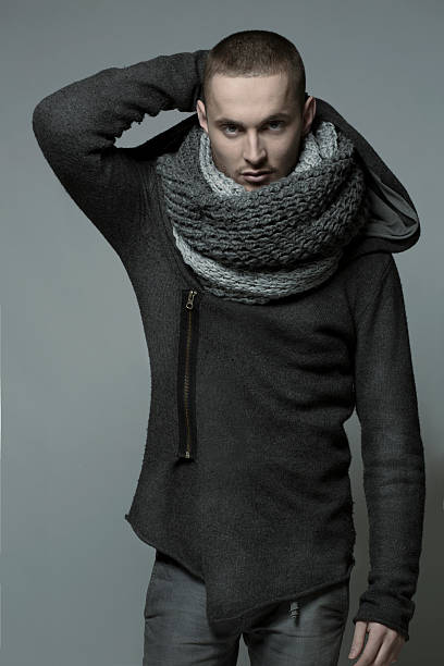 istock Young handsome man in a grey wrap, shawl 489088463