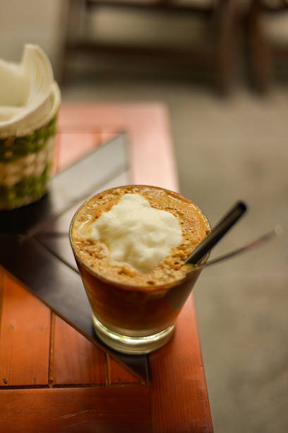 istock Coconut Coffee at Sidewalk Cafe, Hanoi, Vietnam 489088828