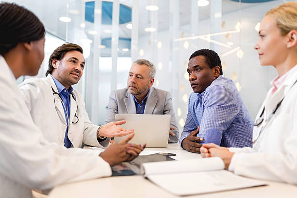 istock Doctors and business people communicating on a meeting. 489089964