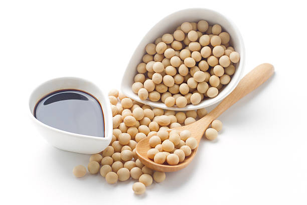 istock Soy sauce and soy beans isolated on white 489090854