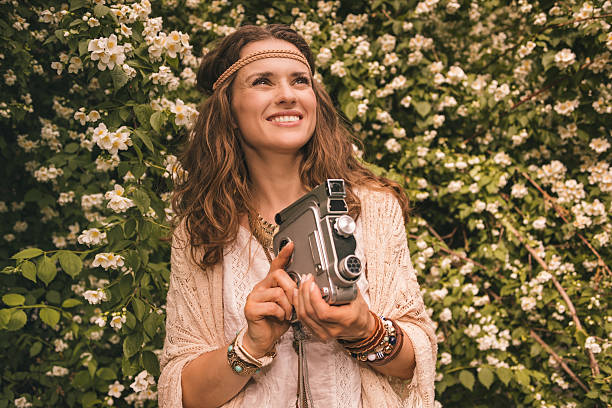 istock bohemian woman with retro camera looking up on copy space 489091120