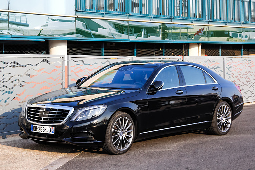 Cannes, France - August 3, 2014: Black luxury car Mercedes-Benz W222 S-class parked at the city street.