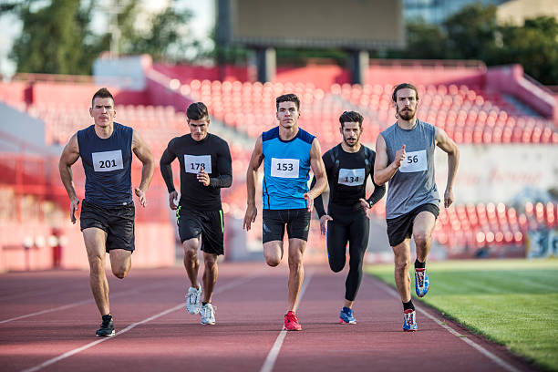 istock Young athletic team running a marathon on a stadium. 489110206
