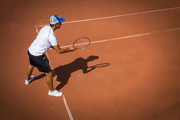 istock Young man playing tennis 489110898