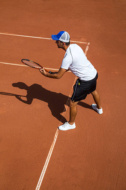 istock Young man playing tennis 489111236