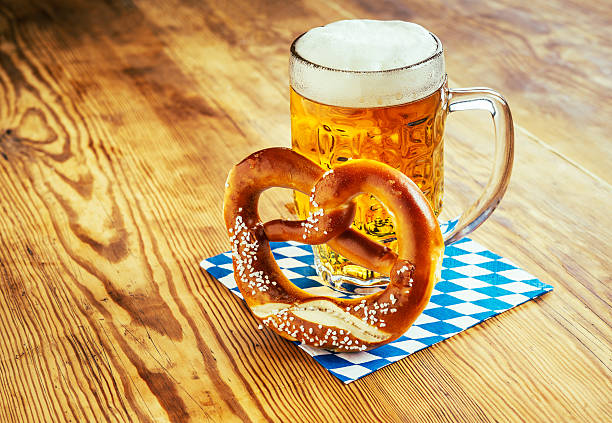 Beer and Pretzel, Beer Fest beer glass and pretzel on wooden table oktoberfest beer stock pictures, royalty-free photos & images