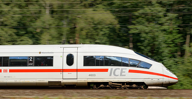 ICE High Speed Train driving in nature Oosterbeek, The Netherlands - September 10, 2015: Approaching German high speed ICE train on the Amsterdam-Cologne line. deutsche bahn stock pictures, royalty-free photos & images