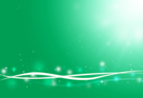 Green wave and glitter sparkle defocused rays lights bokeh abstract background.