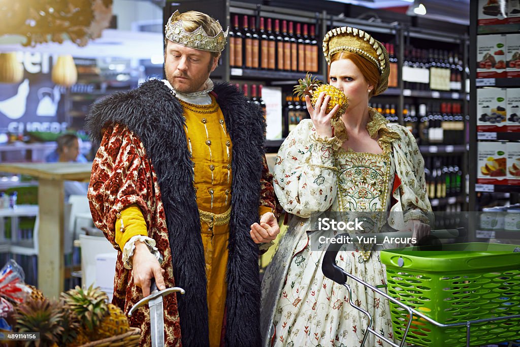 What manner of fruit beith so prickly? Shot of a king and queen inspecting fruit while out shopping in a modern supermarkethttp://195.154.178.81/DATA/i_collage/pi/shoots/784234.jpg Humor Stock Photo