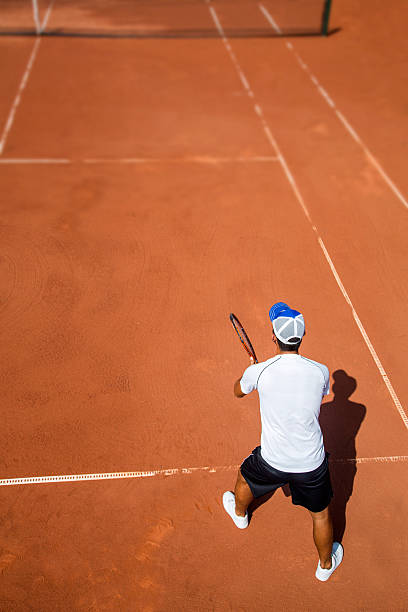 istock Young man playing tennis 489114392