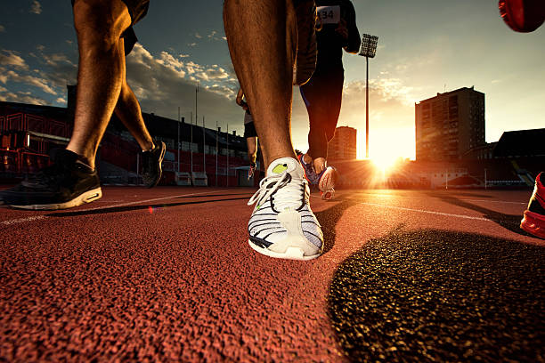 istock Group of unrecognizable athletes running a marathon at sunset. 489115068