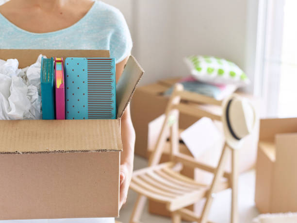 istock Woman with open cardboard box 489115628