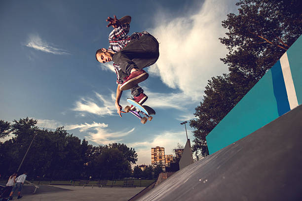 istock Below view of skillful skateboarder having fun at skate park. 489116590