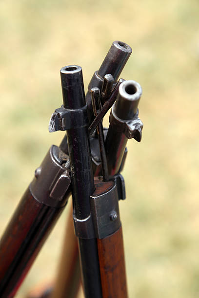istock canes assault rifles standing close together. 489116620