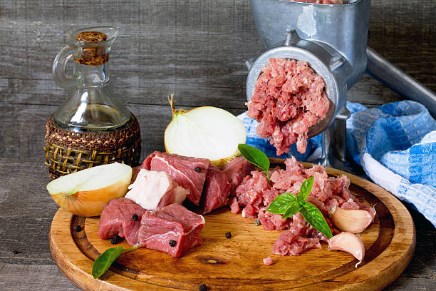 istock Beef, onion, raw meat and meat grinder 489116884