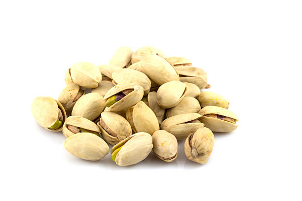 istock pistachios isolated on white background 489119261