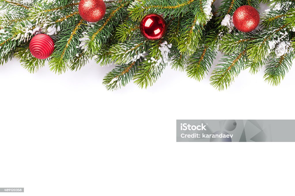 Christmas tree branch with baubles Christmas tree branch with baubles becor. Isolated on white background 2015 Stock Photo