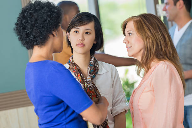 istock Diverse female friends having serious discussion in lobby 489120475