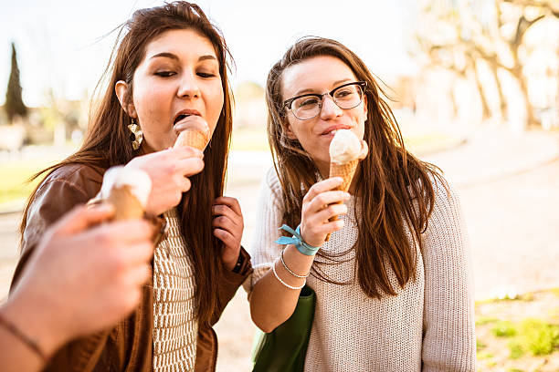 istock group of friends eating icecream on summer 489121015