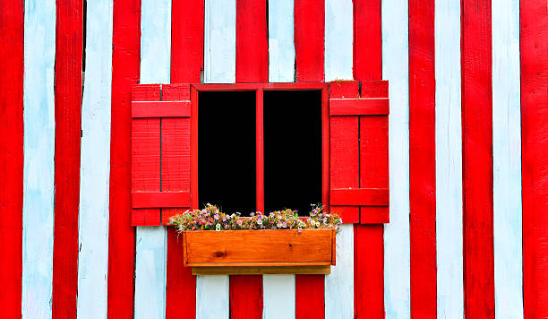 istock red window on red and white wooden wall 489121293