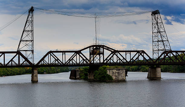 istock Railroad bridge on Hudson River NY cloudy day 489121298
