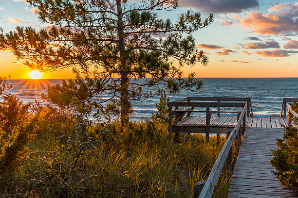 istock Wooden Deck Overlooking a Lake Huron Sunset - Ontario, Canada 489122588