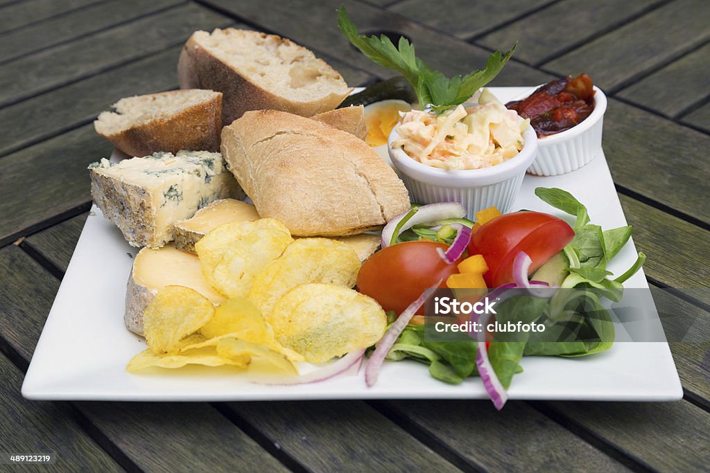 Ploughmans lunch with cheese A Ploughmans Lunch with an assortment of different cheeses Ploughman's Lunch Stock Photo